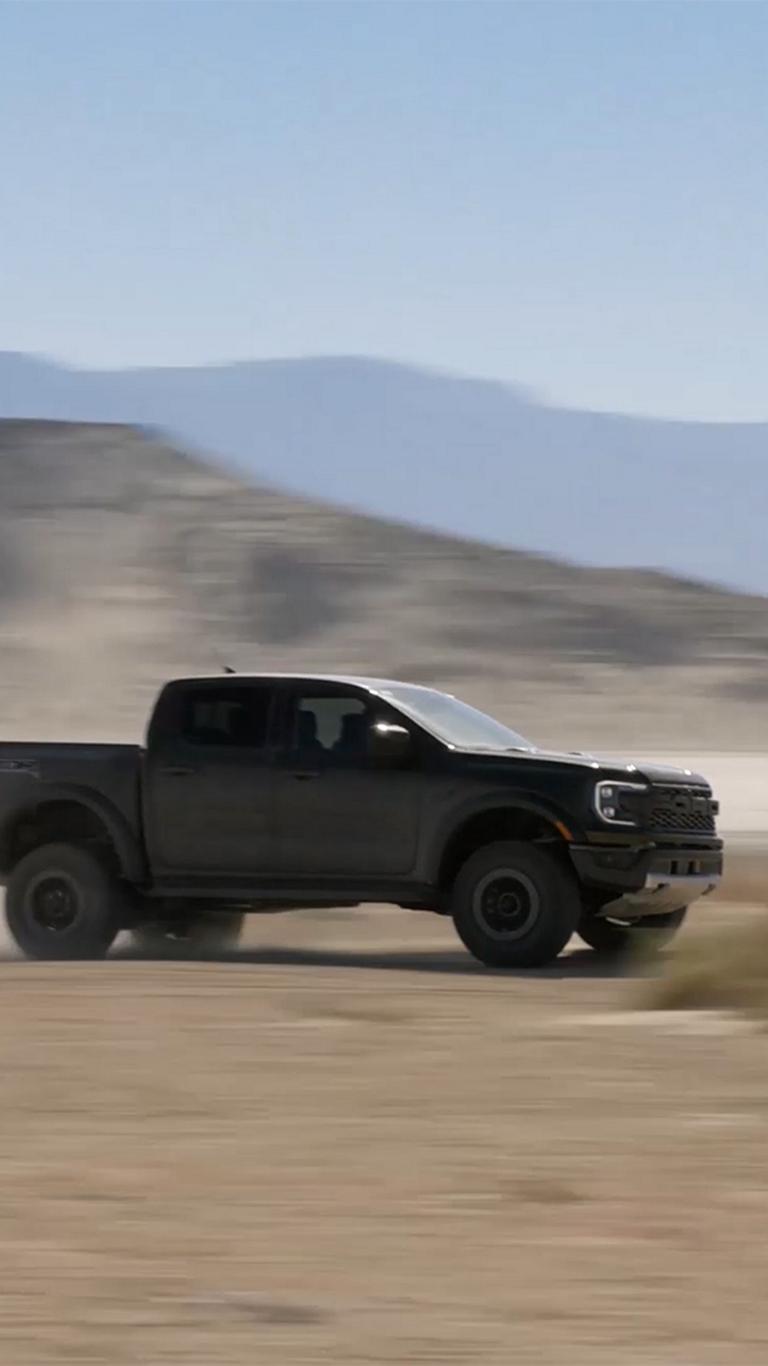 A 2026 Ford Ranger® Raptor® tearing through the desert