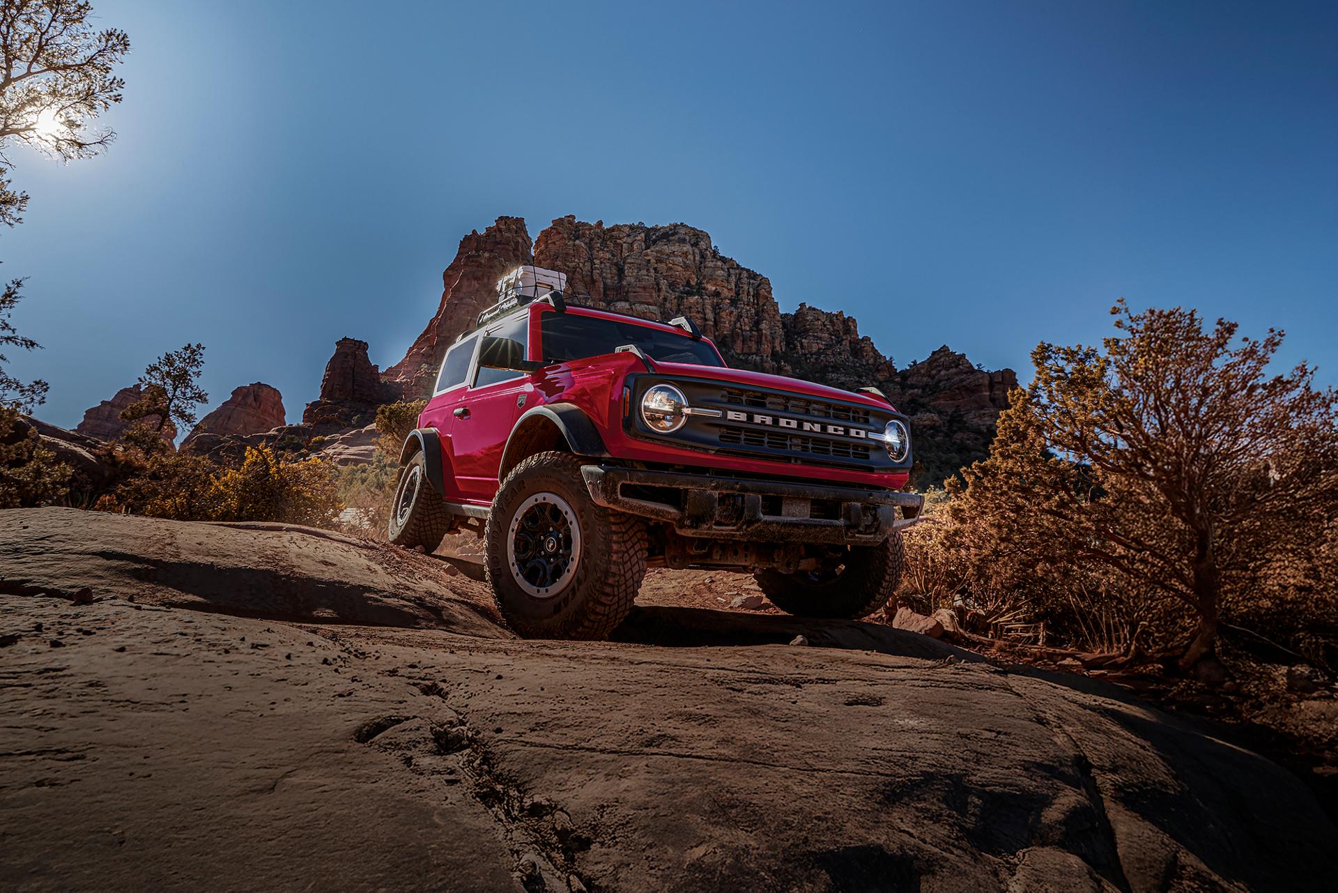 A 2026 Ford Bronco® SUV with the available Sasquatch® Package descending a muddy hill