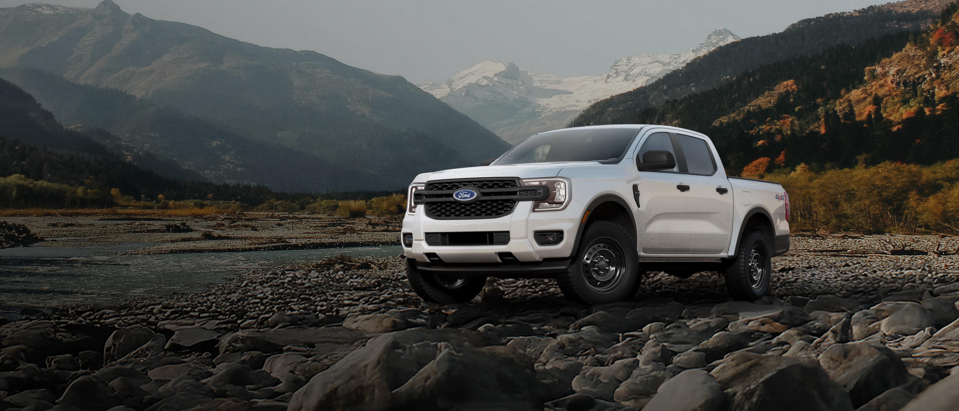 A 2026 Ford Ranger® XL model parked on a rocky river bank in the mountains