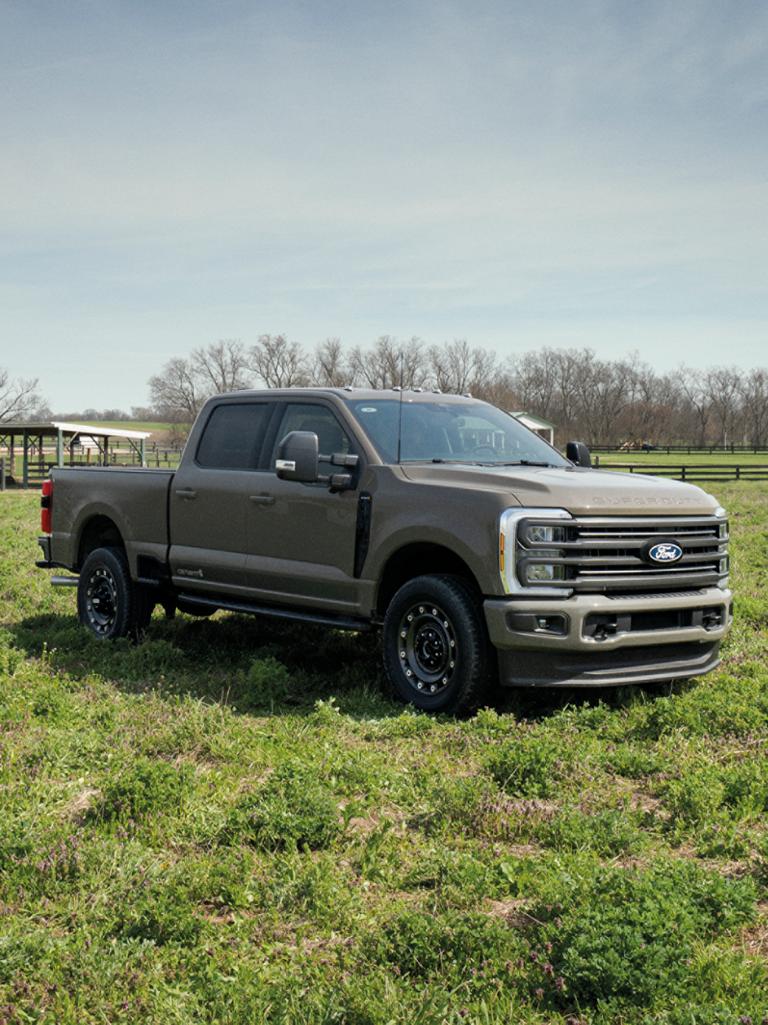 2027 Ford Super Duty® F-250® XLT model with the Super Duty Carhartt Package parked in a field