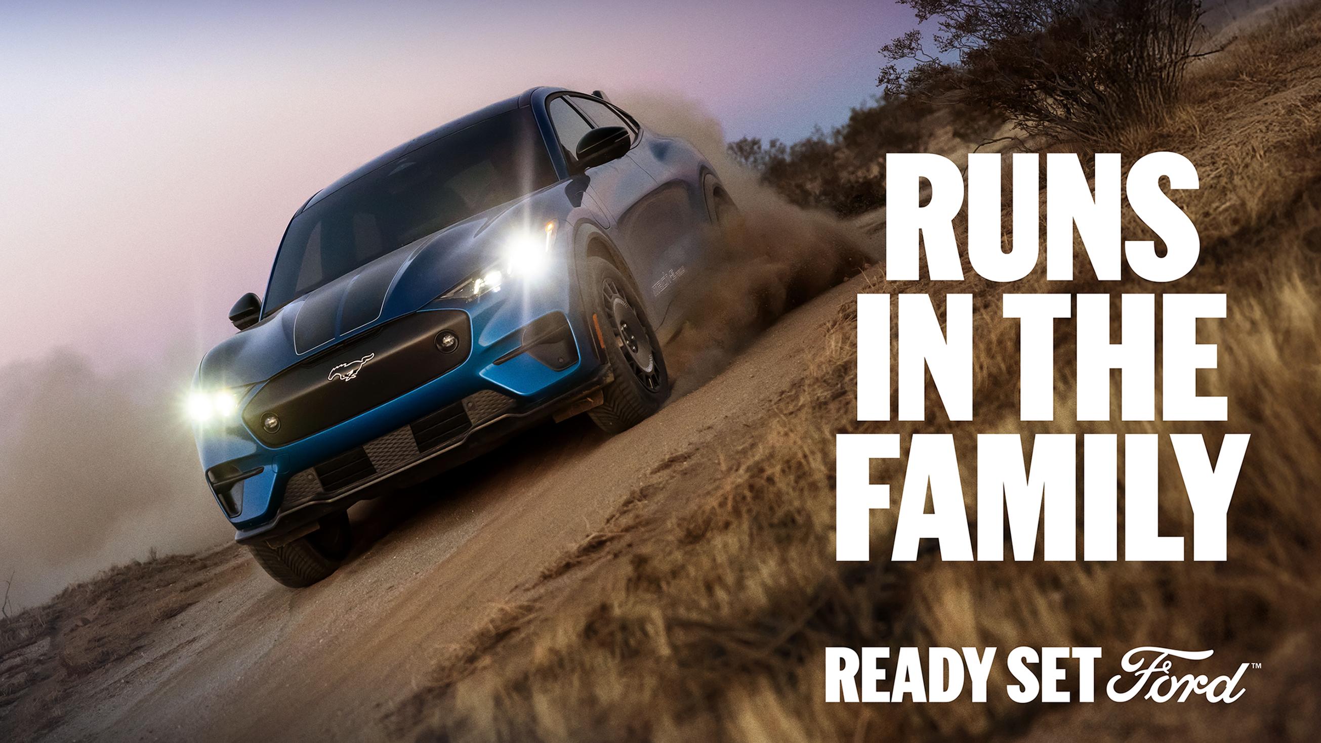 A 2025 Ford Mustang Mach-E® Rally racing on a dirt road