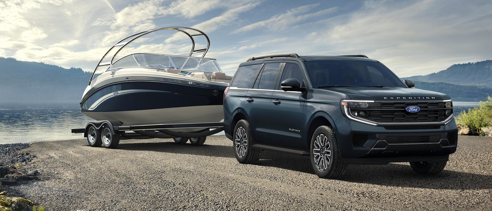 2027 Ford Expedition® Platinum® SUV with a driver towing a boat on a trailer