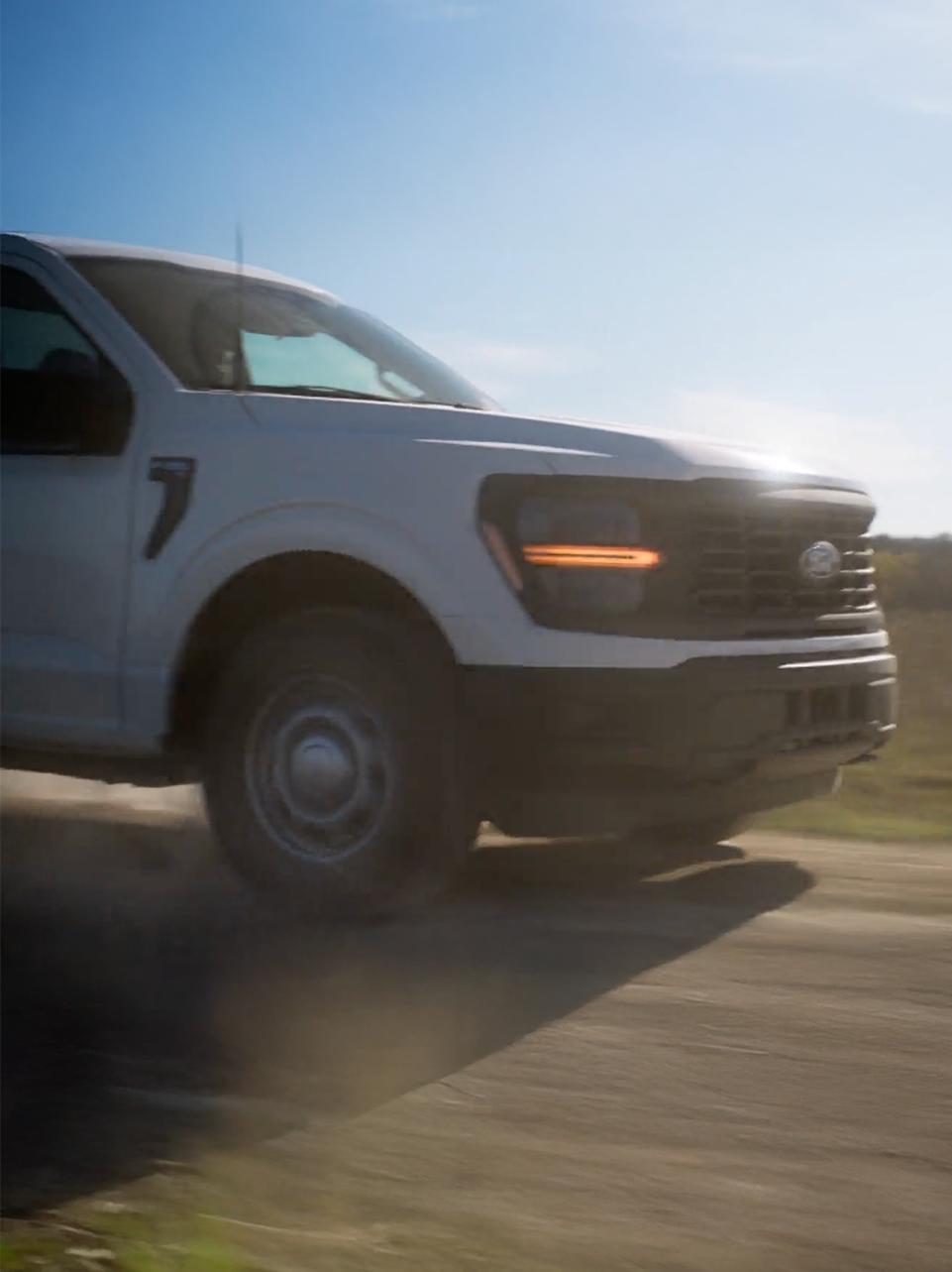 A 2026 Ford F-150® being driven on a dirt road