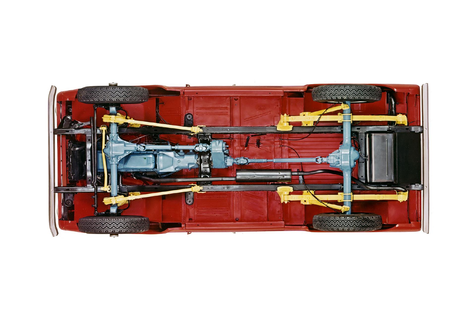 A 1967 Ford Bronco® model pictured from below the vehicle to showcase its frame and suspension
