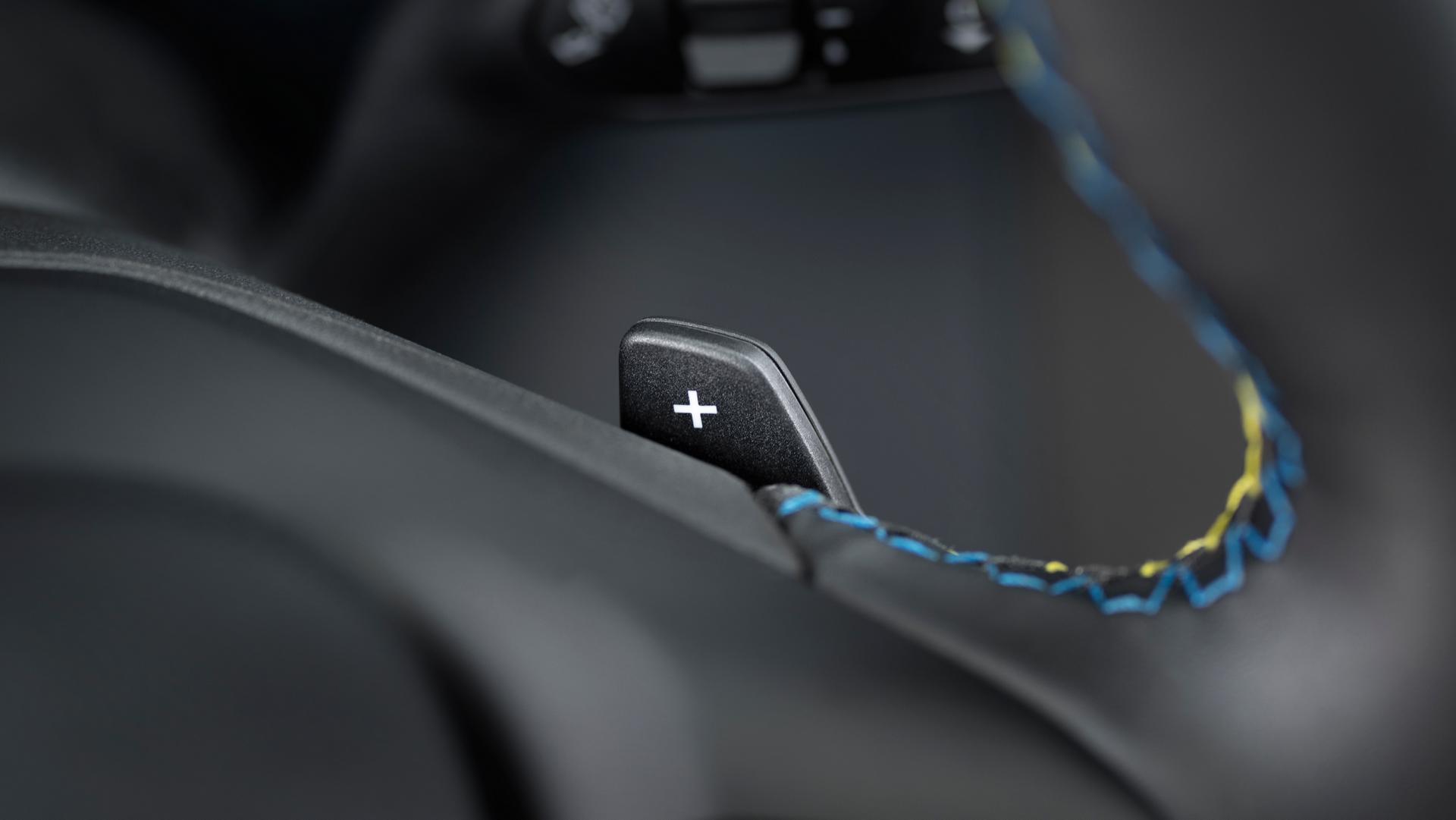 Close-up of the paddle shifter and accent stitching on the steering wheel of a 2026 Ford Maverick® Lobo™ pickup
