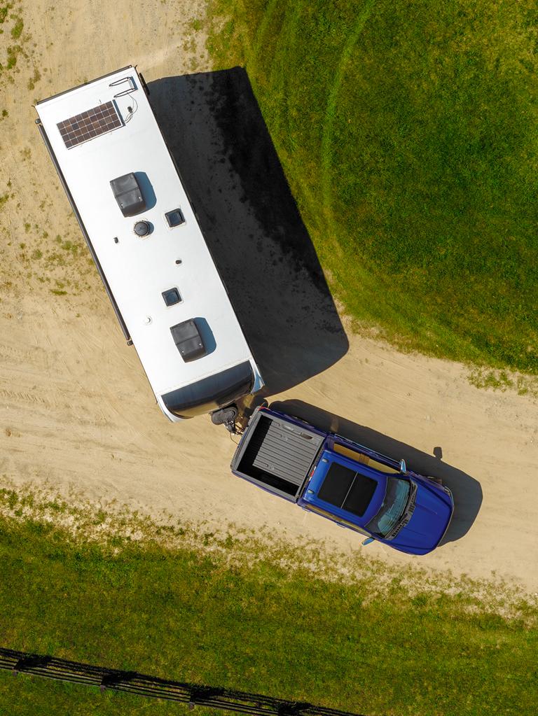 Aerial view of a 2026 Ford F-150® pickup pulling a large camper