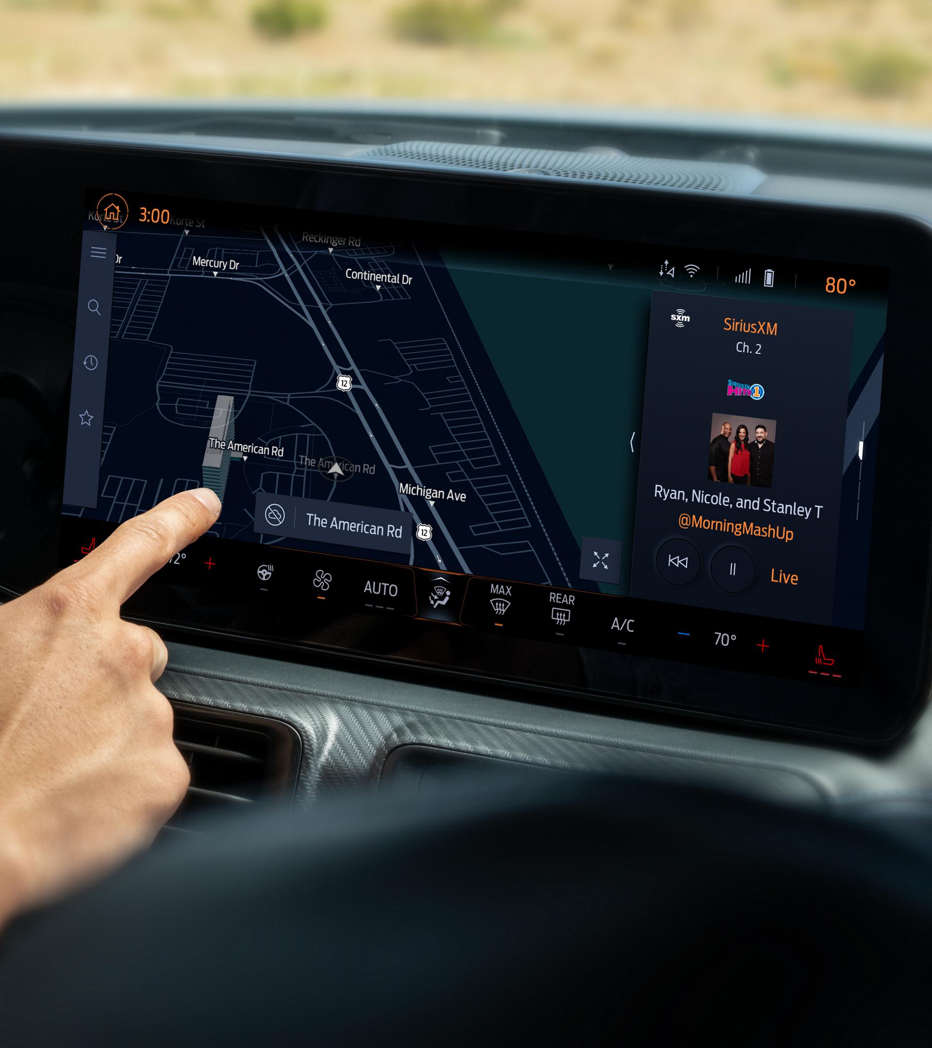 Driver using the 2026 Ford Mustang® 13.2" LCD capacitive touchscreen with swipe capability