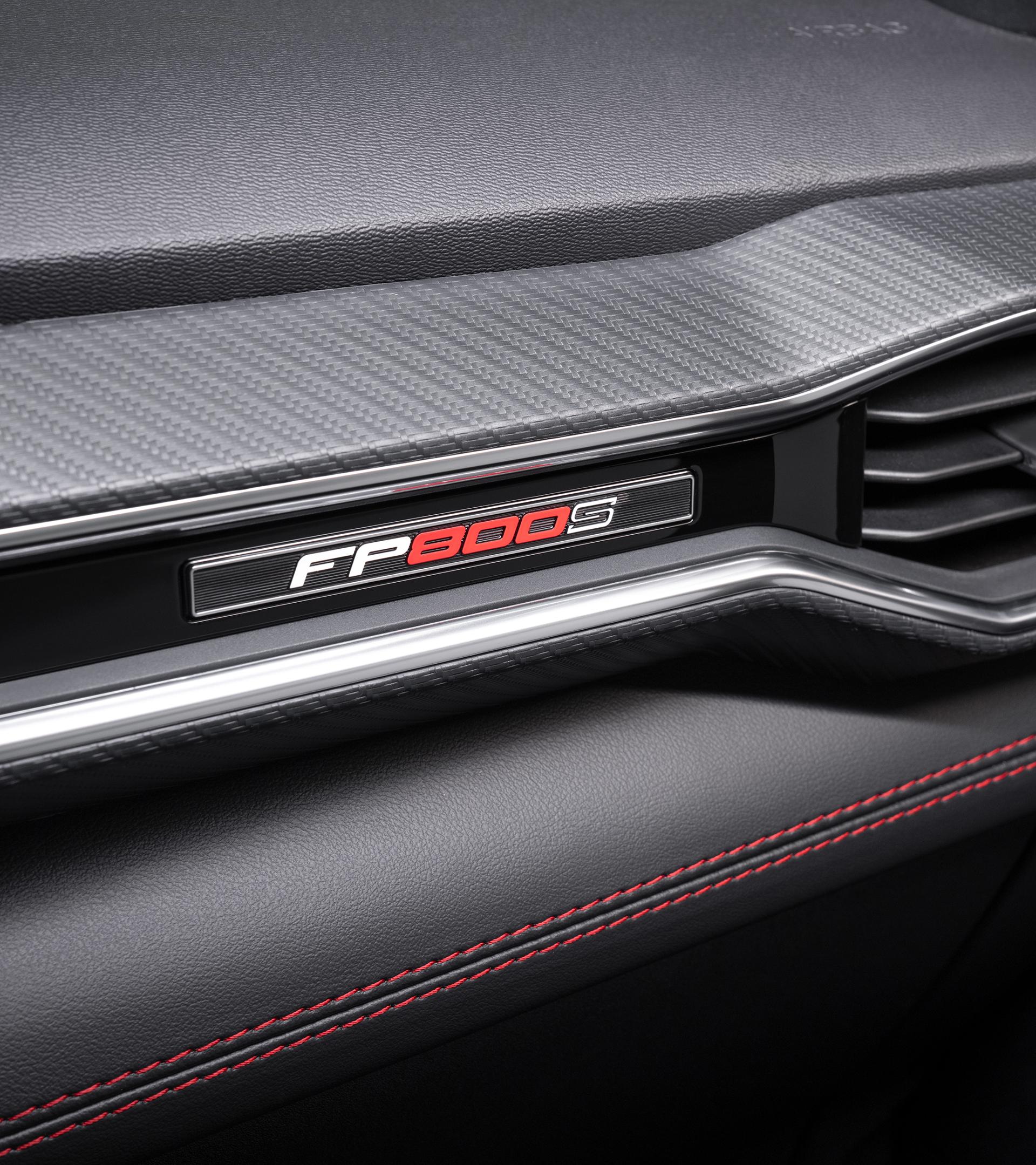 Interior dashboard trim with the FP800S badge and red contrast stitching
