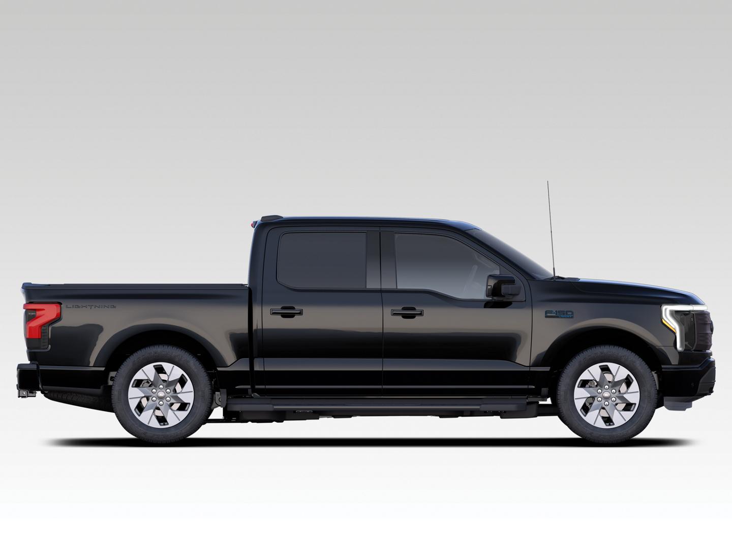 A 2024 Ford F-150® Lightning® Lariat pickup on white background