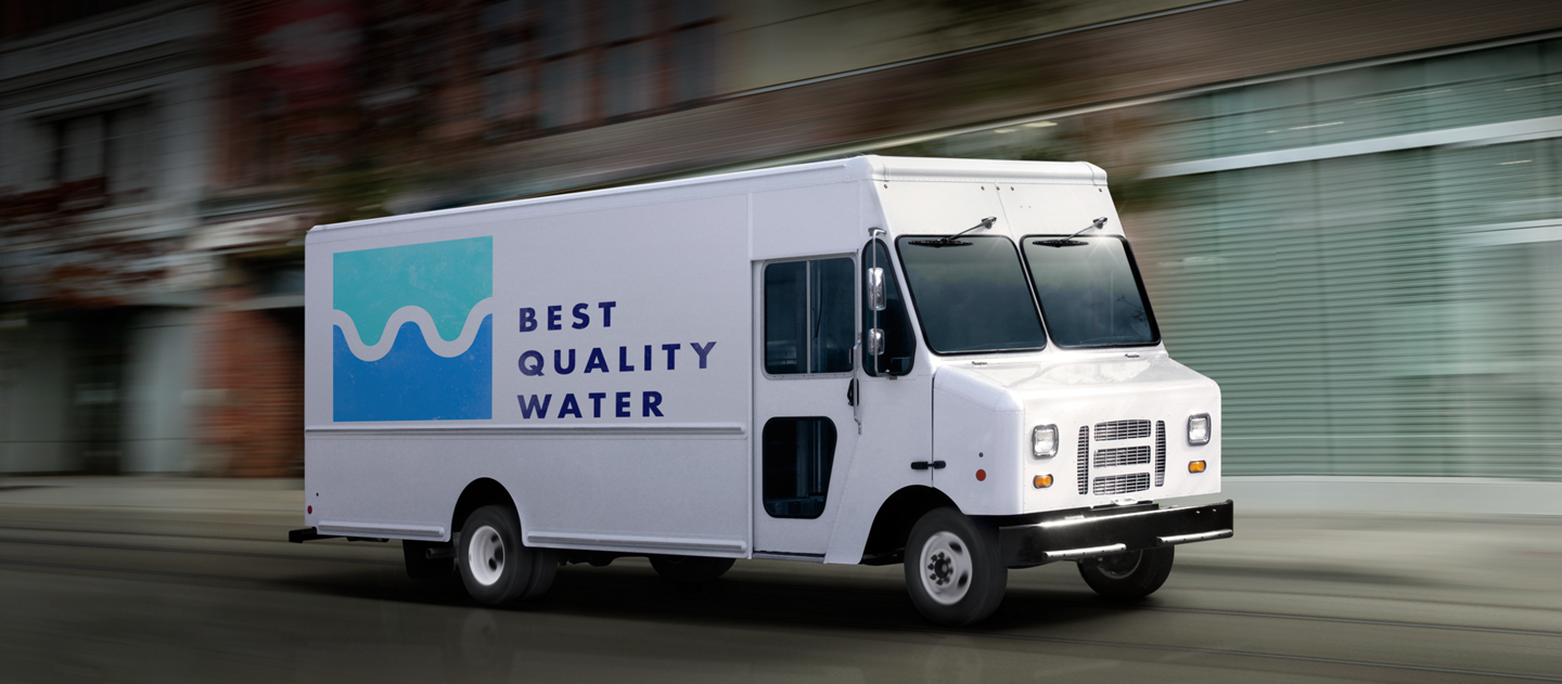 A commercial water delivery van being driven down the road