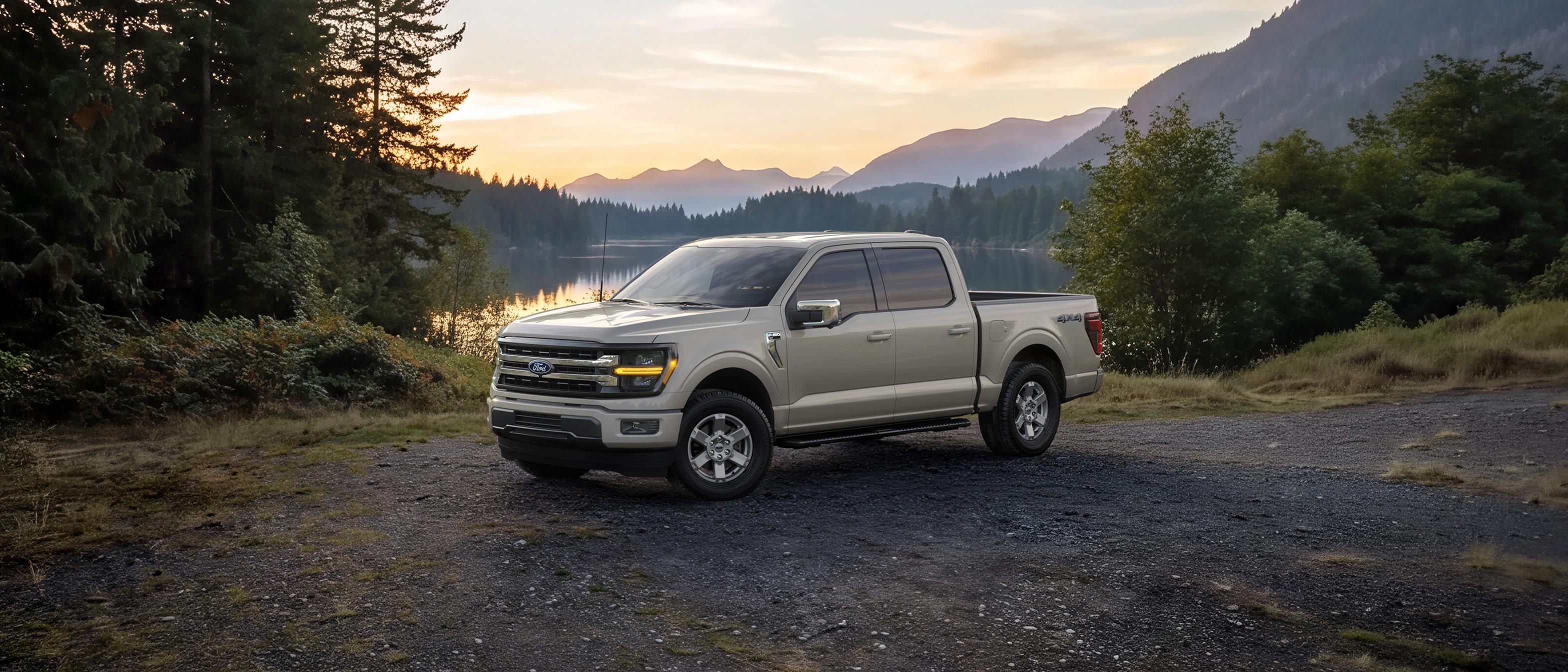 2027 Ford F-150® XLT parked near a mountain lake