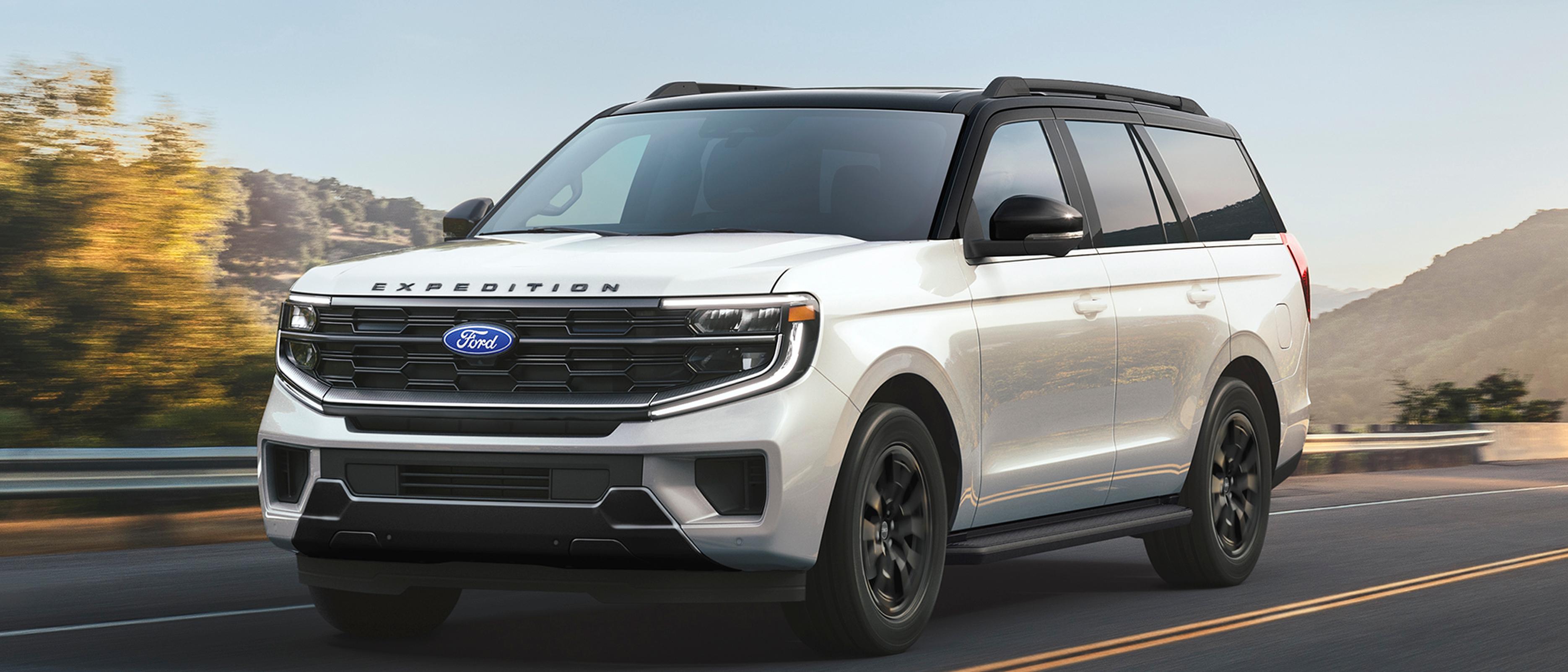 A 2027 Ford Expedition® Platinum® SUV being driven on a street