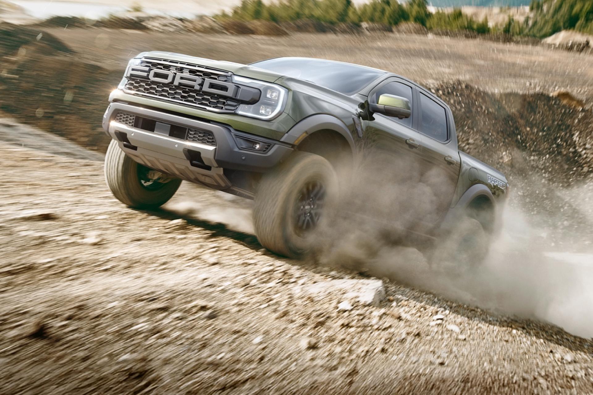 Green 2026 Ford Ranger® truck being driven across a dusty terrain