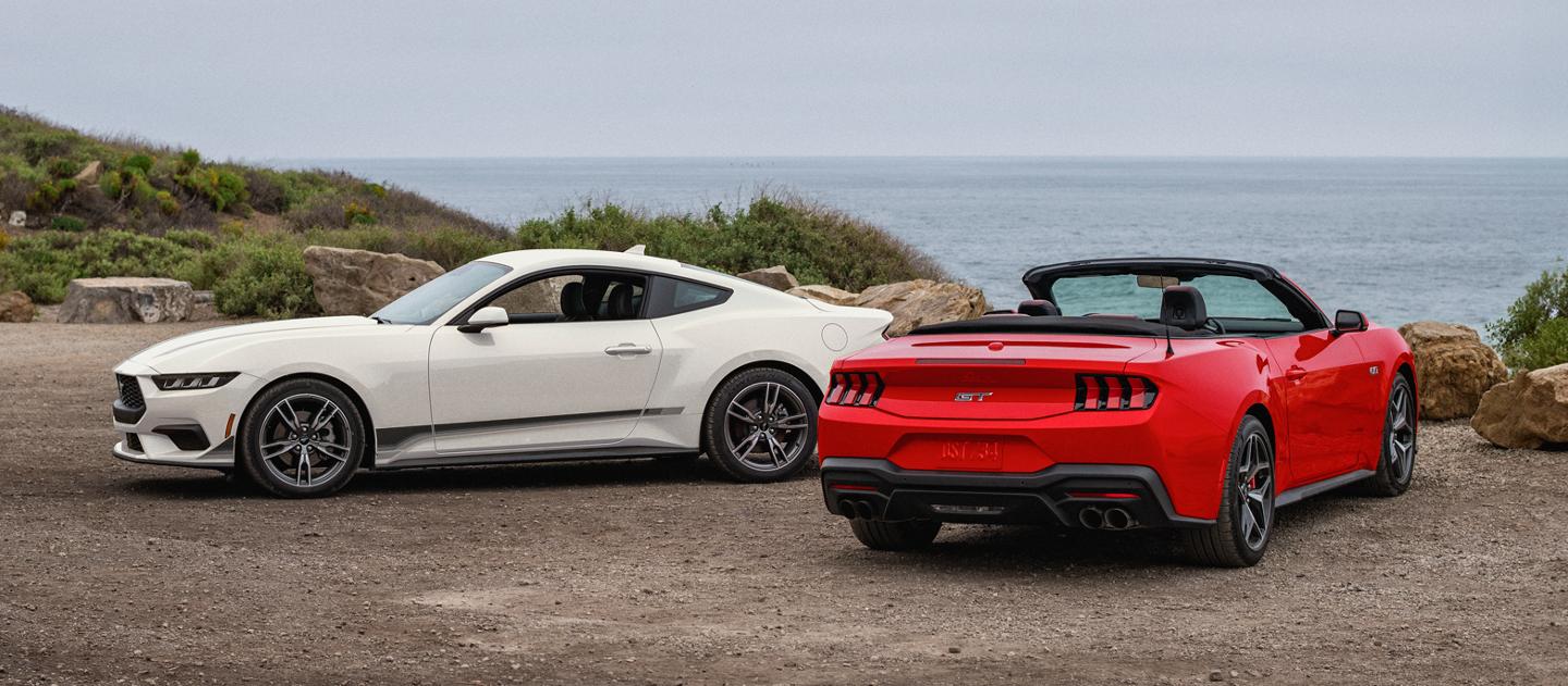 2025 Ford Mustang® coupe and convertible parked near the ocean