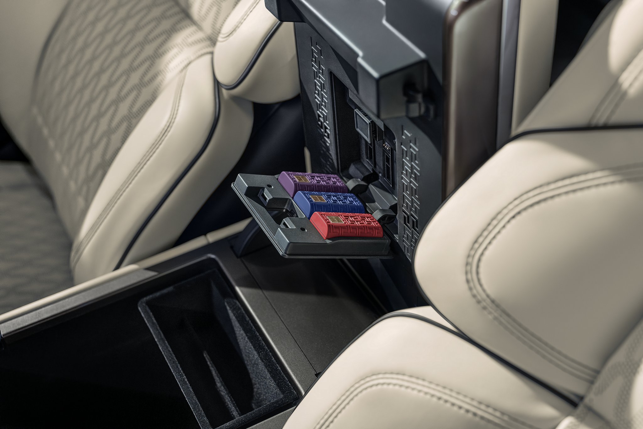 Digital Scent cartridges are shown inserted within the front armrest