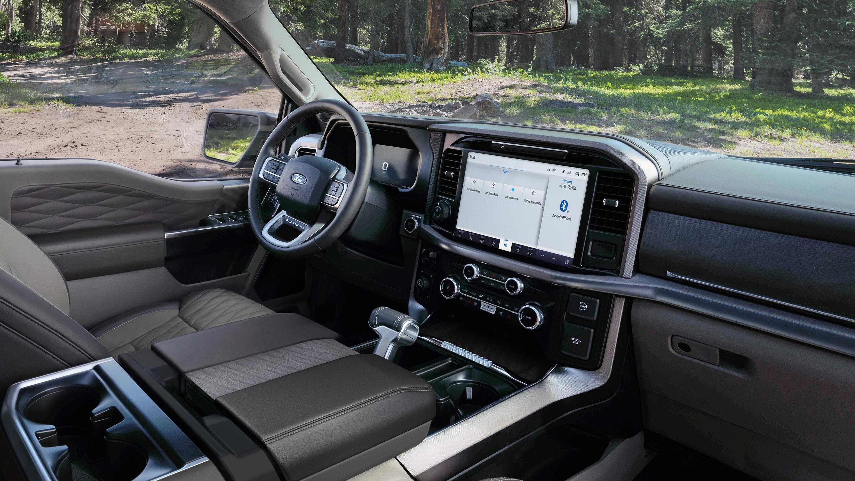 Interior of a 2027 Ford F-150® Platinum® model parked in a wooded setting