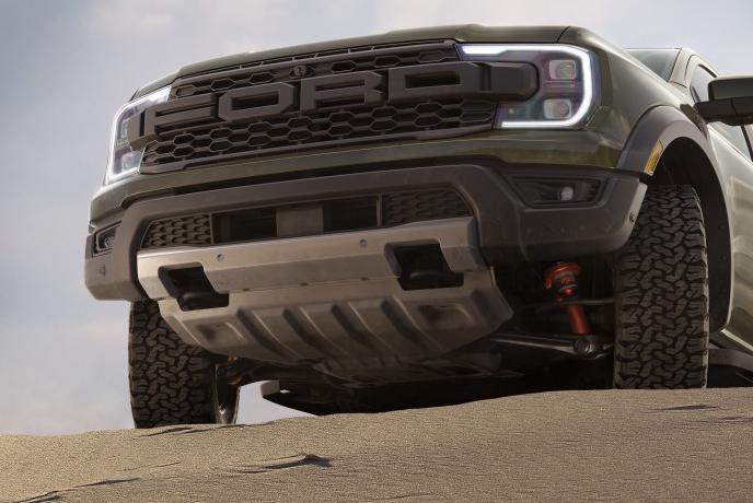A front view of a gray 2026 Ford Ranger® Raptor® parked in the desert