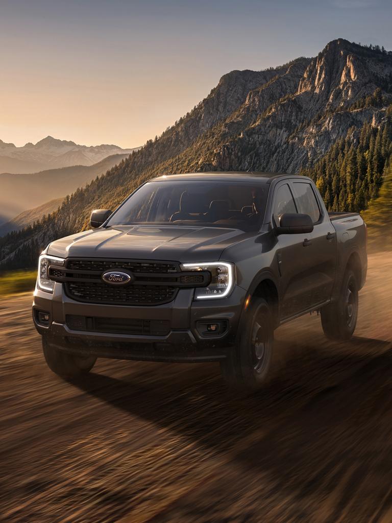 2026 Ford Ranger® XL model with the STX® appearance package being driven in the mountains