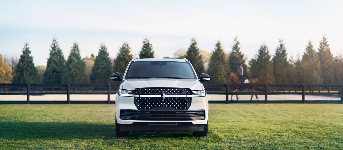 A Lincoln vehicle parked on the grass.
