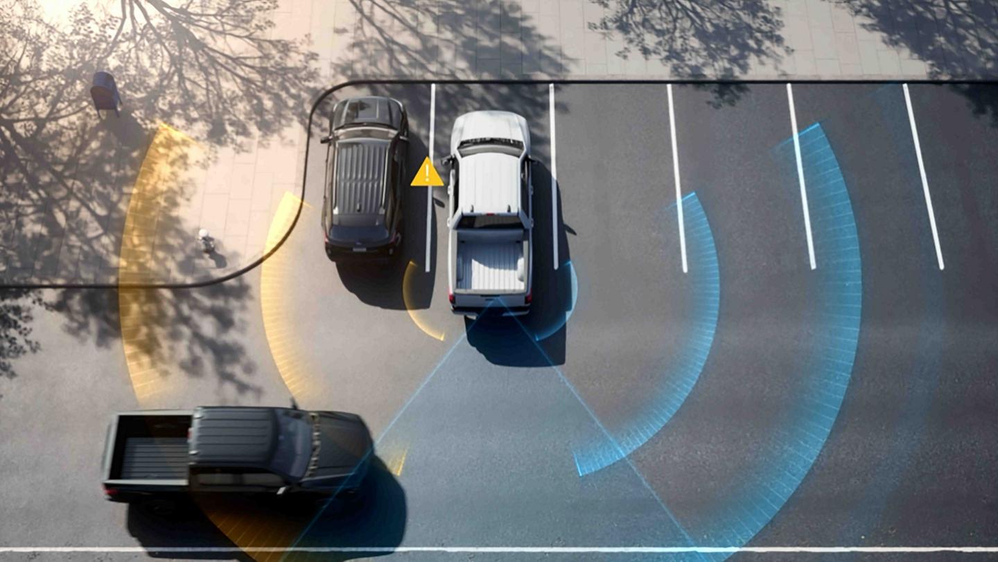 The Cross Traffic Alert feature, with blue sensor lines emitting from a 2025 Ford F-150® Lightning® pickup