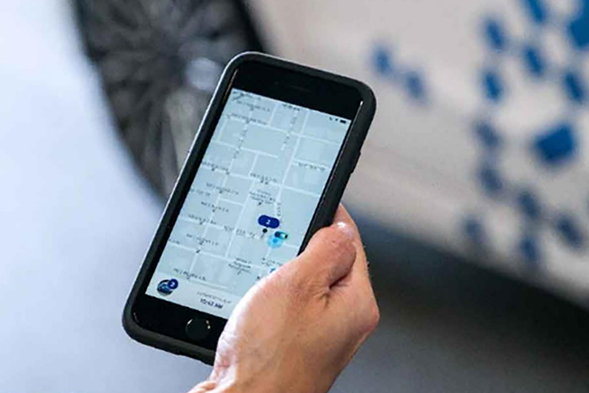 A business owner tracks their delivery through an app