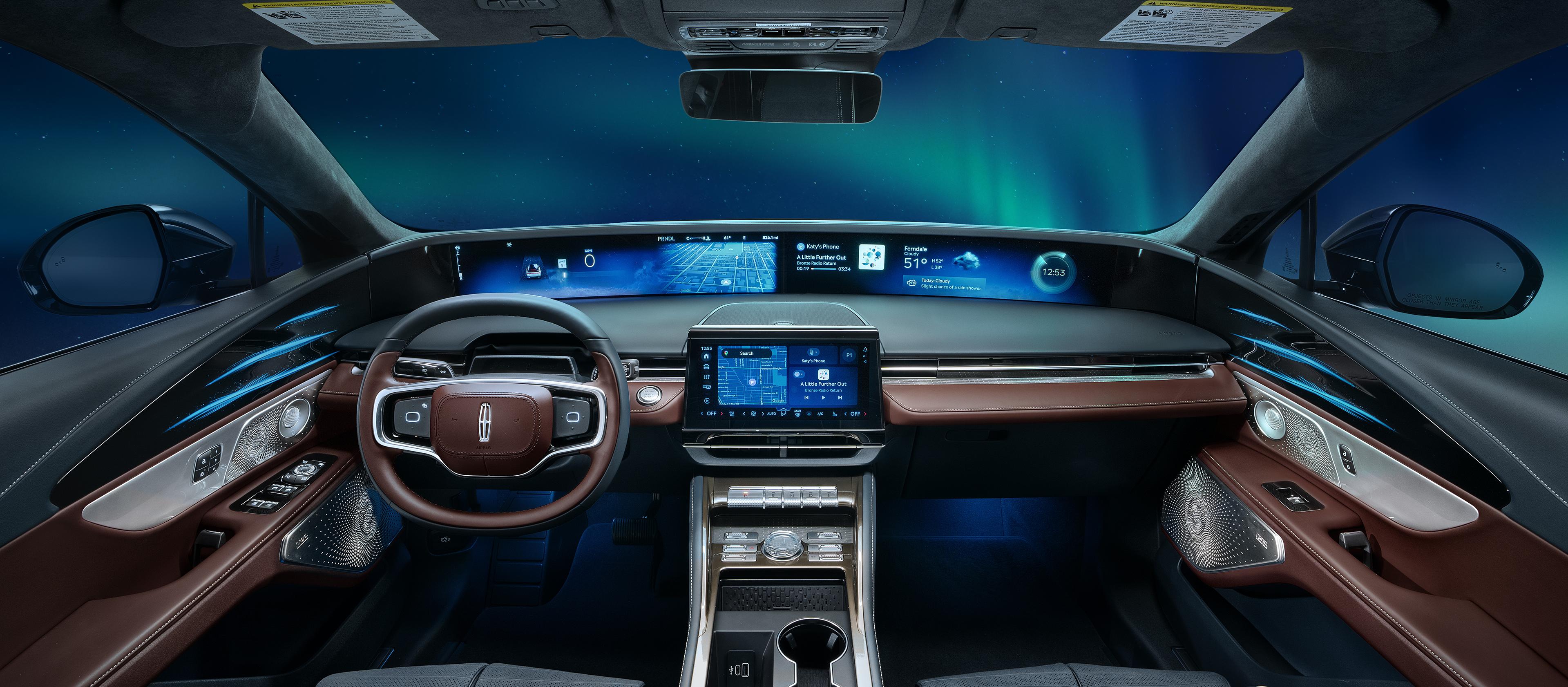 The northern light light up the night sky as seen through the windshield of a 2026 Lincoln Black Label™ Nautilus® SUV with the Aurora interior theme