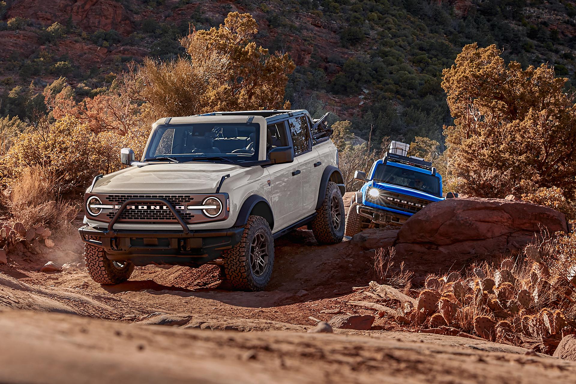 A line of 2026 Ford Bronco® SUVs parked next to each other on a mud flat