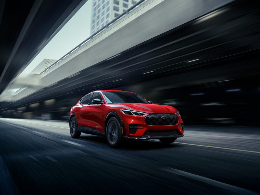 2026 Ford Mustang Mach-E® being driven down a city street