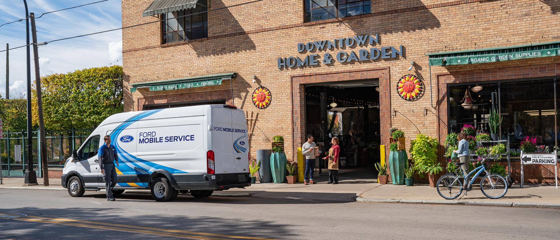 A Ford Mobile Service technician arrives at a workplace to service a Ford vehicle