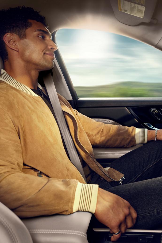 A driver enjoys using Lincoln BlueCruise hands-free restricted access divided highway driving