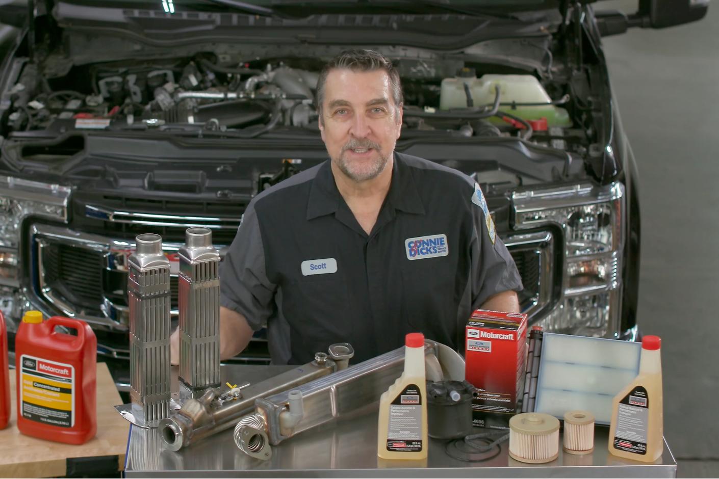 A Ford Service technician with Motorcraft parts