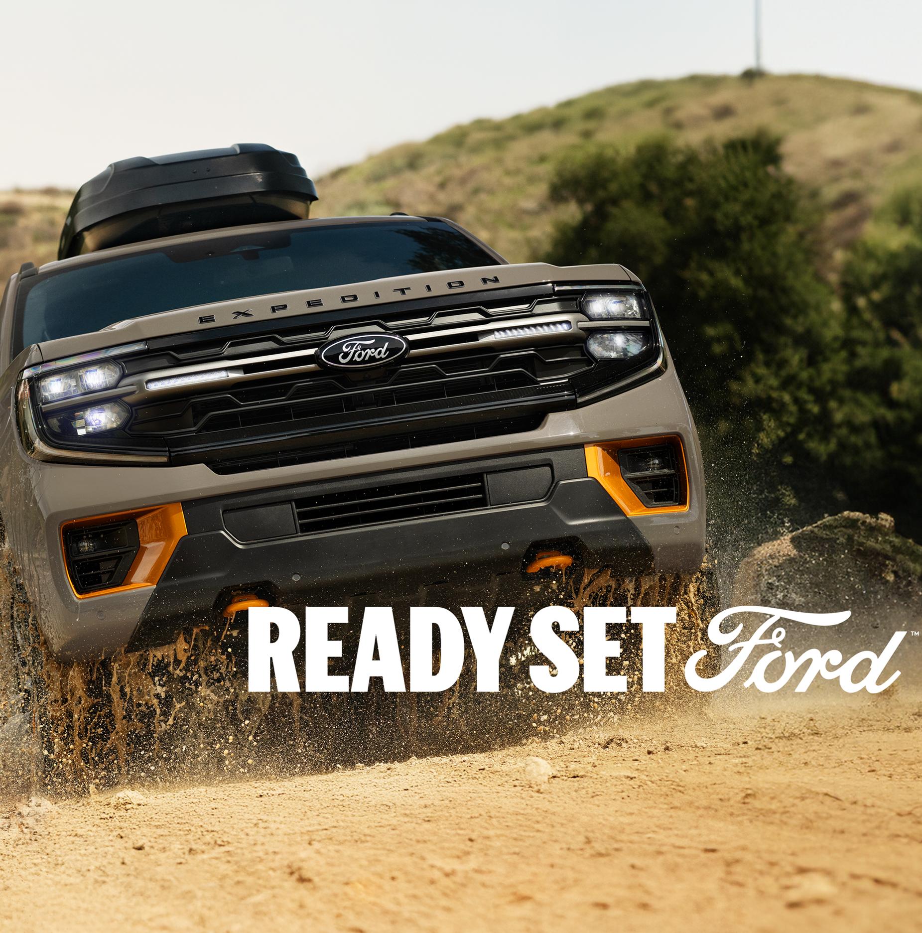 2026 Ford Expedition® Tremor® SUV being driven through a puddle