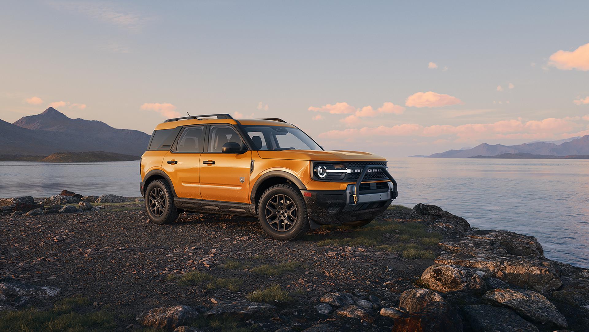 A 2026 Ford Bronco Sport® SUV parked on gravel next to a lake