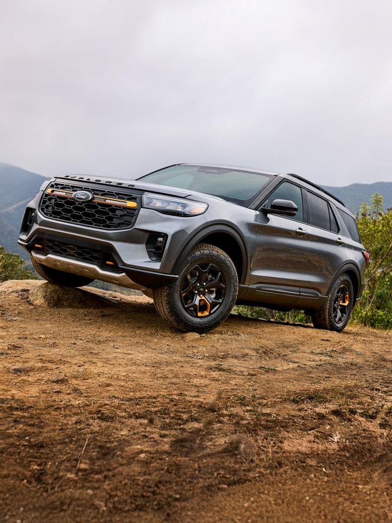 A 2026 Ford Explorer® Tremor® ascends a challenging mountain trail