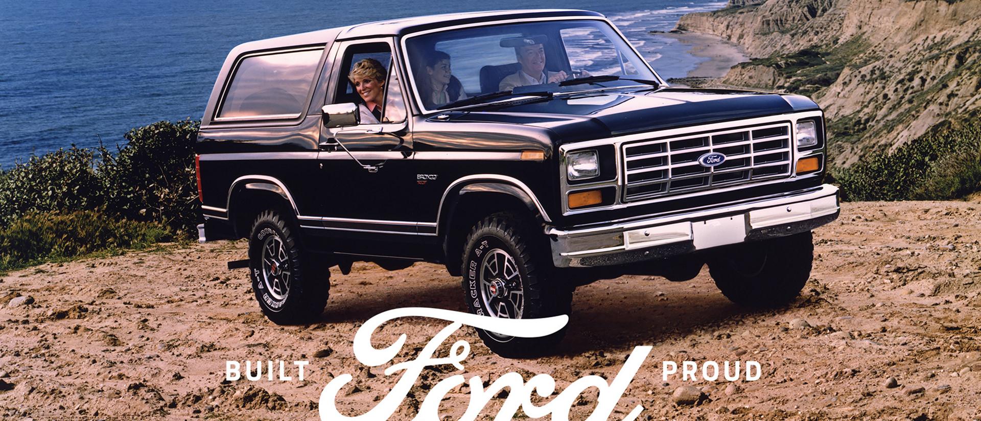 A 1983 Ford Bronco® XLT model parked on an ocean overlook