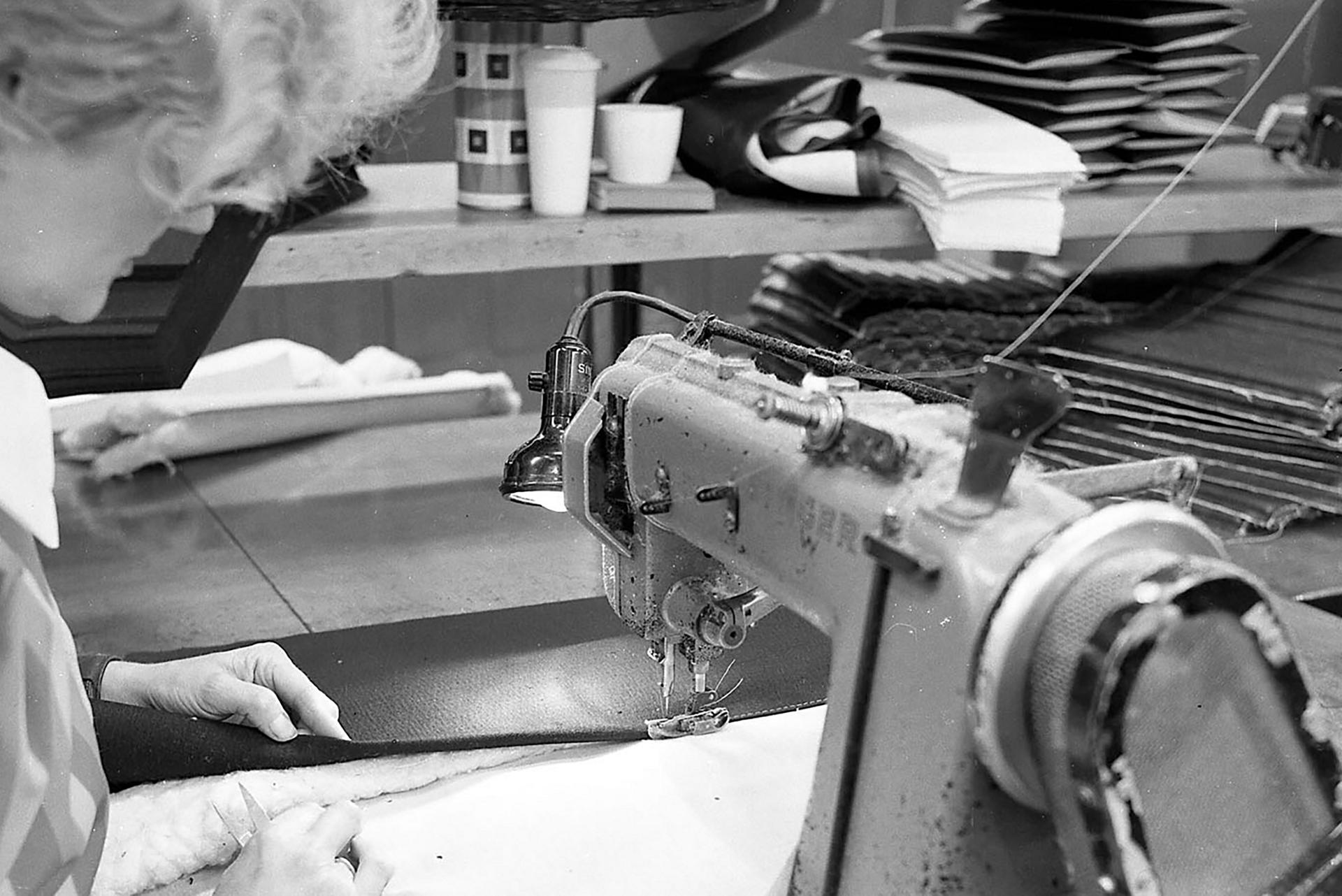 A woman works in a trim shop in 1968