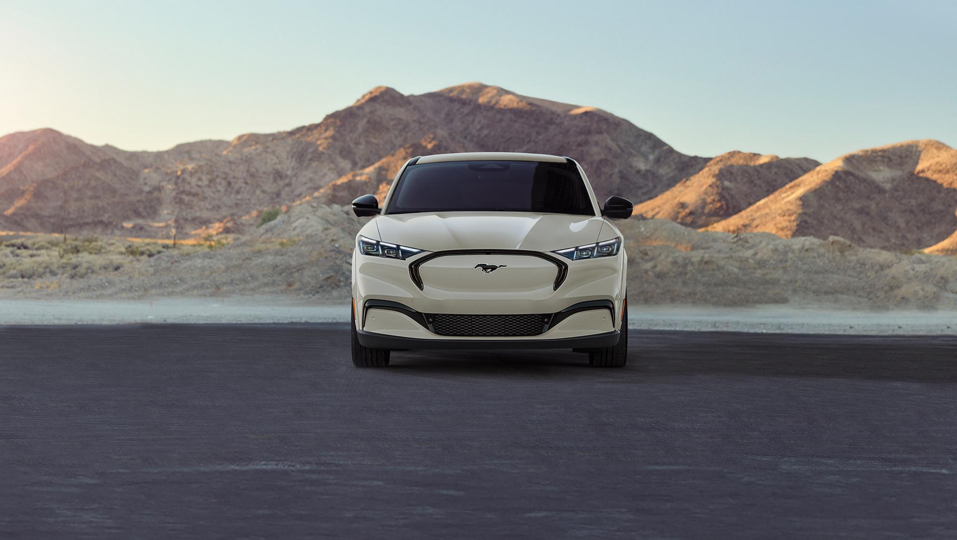 2025 Ford Mustang Mach-E parked in front of mountain range