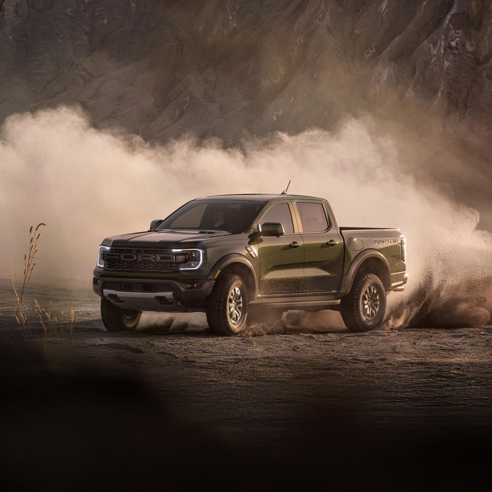2026 Ford Ranger® Raptor® model in Shelter Green off-road driving with dust in the air