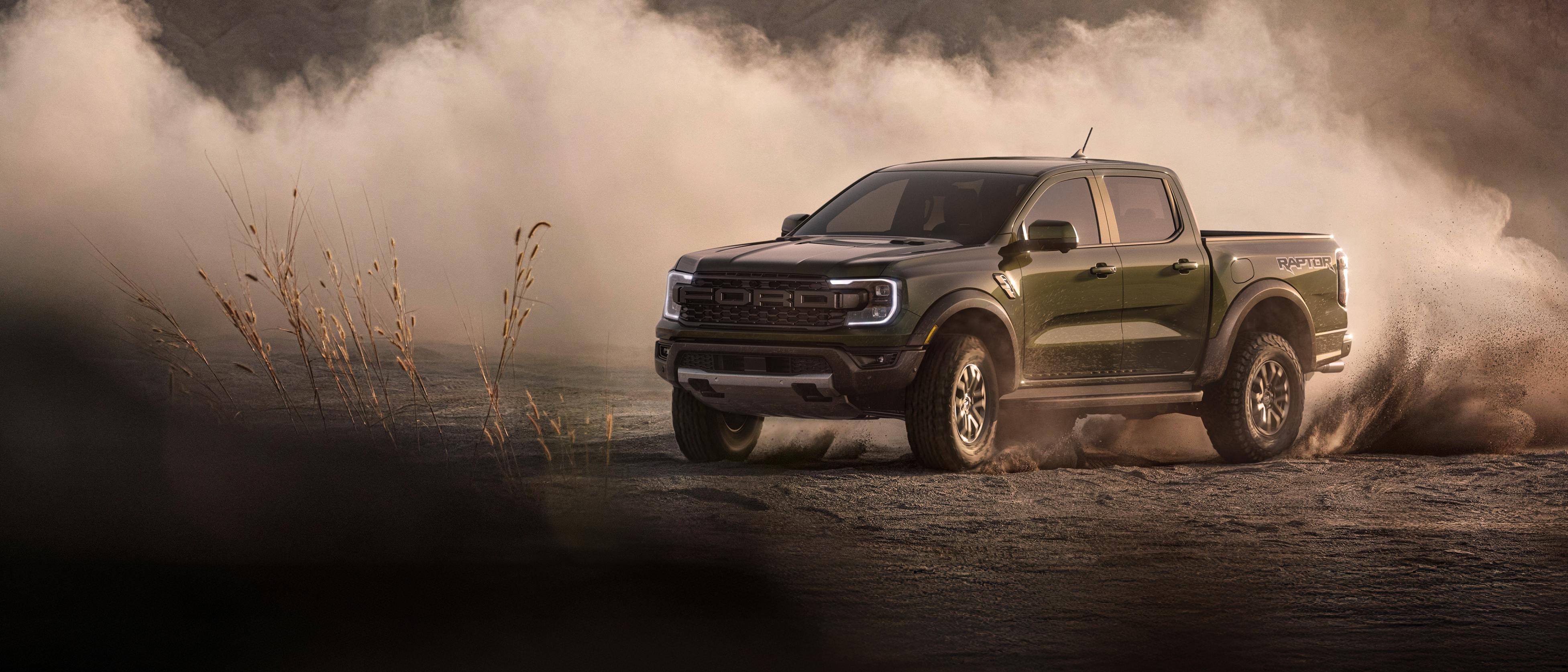 2026 Ford Ranger Raptor® model kicking up dirt while being driven off-road