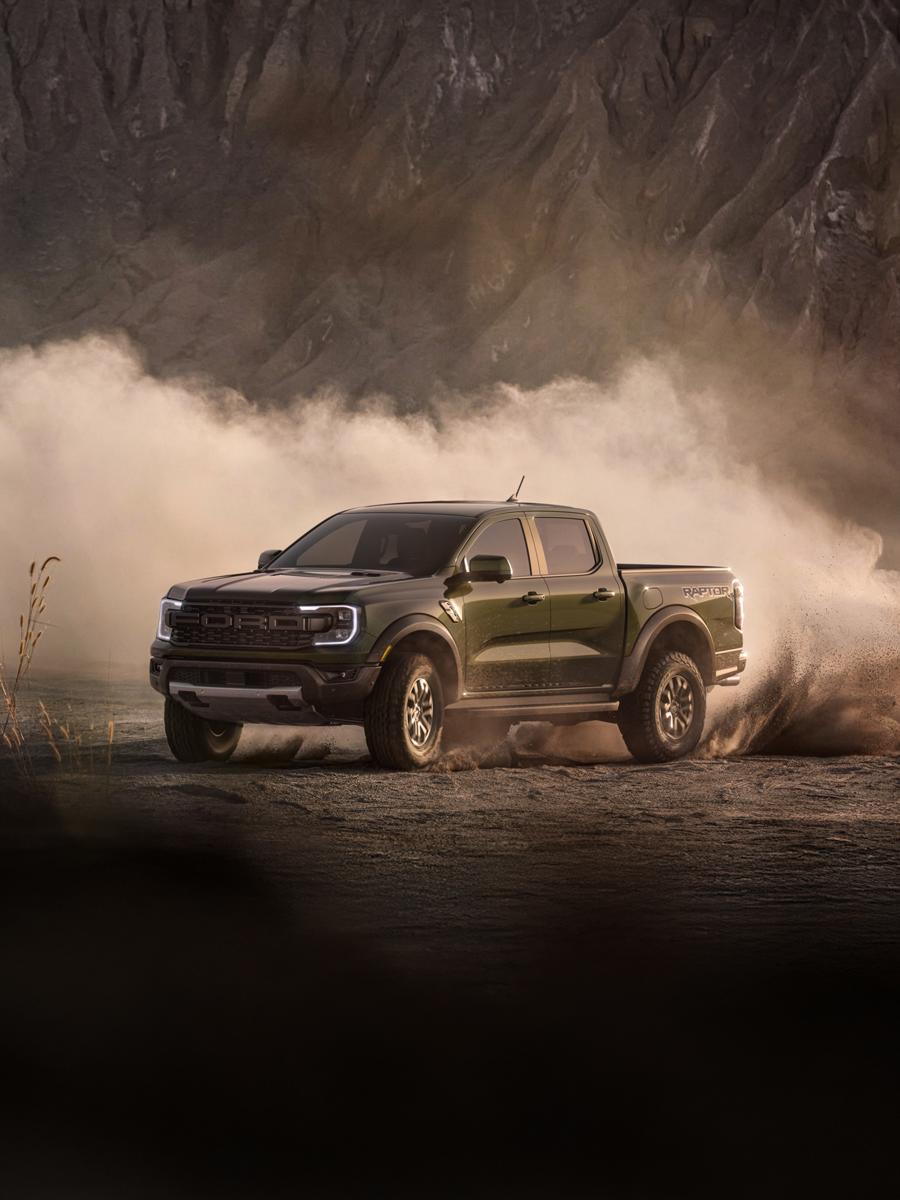 2026 Ford Ranger Raptor® truck driving with speed through a desert