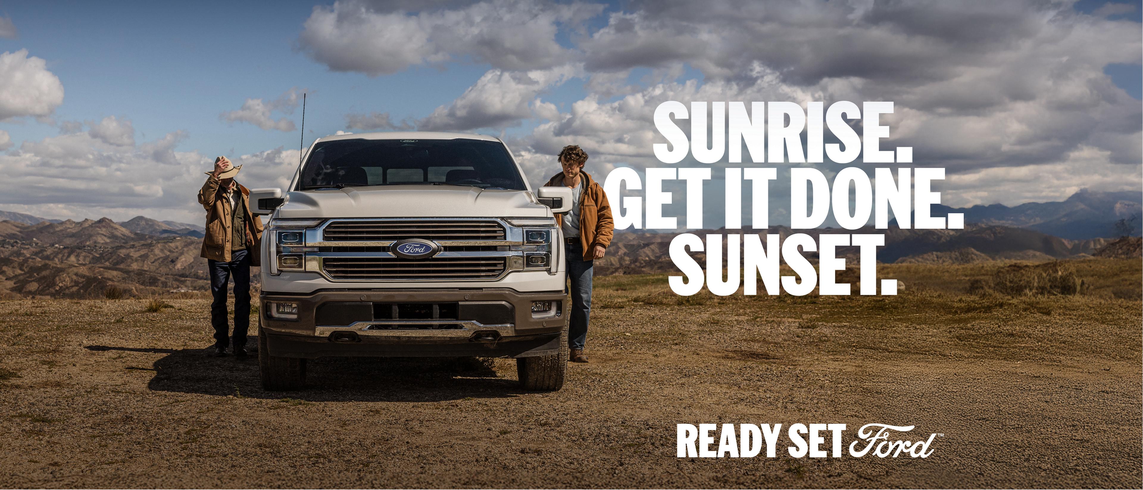 2025 Ford F-150® King Ranch® parked in a field next to two ranch hands