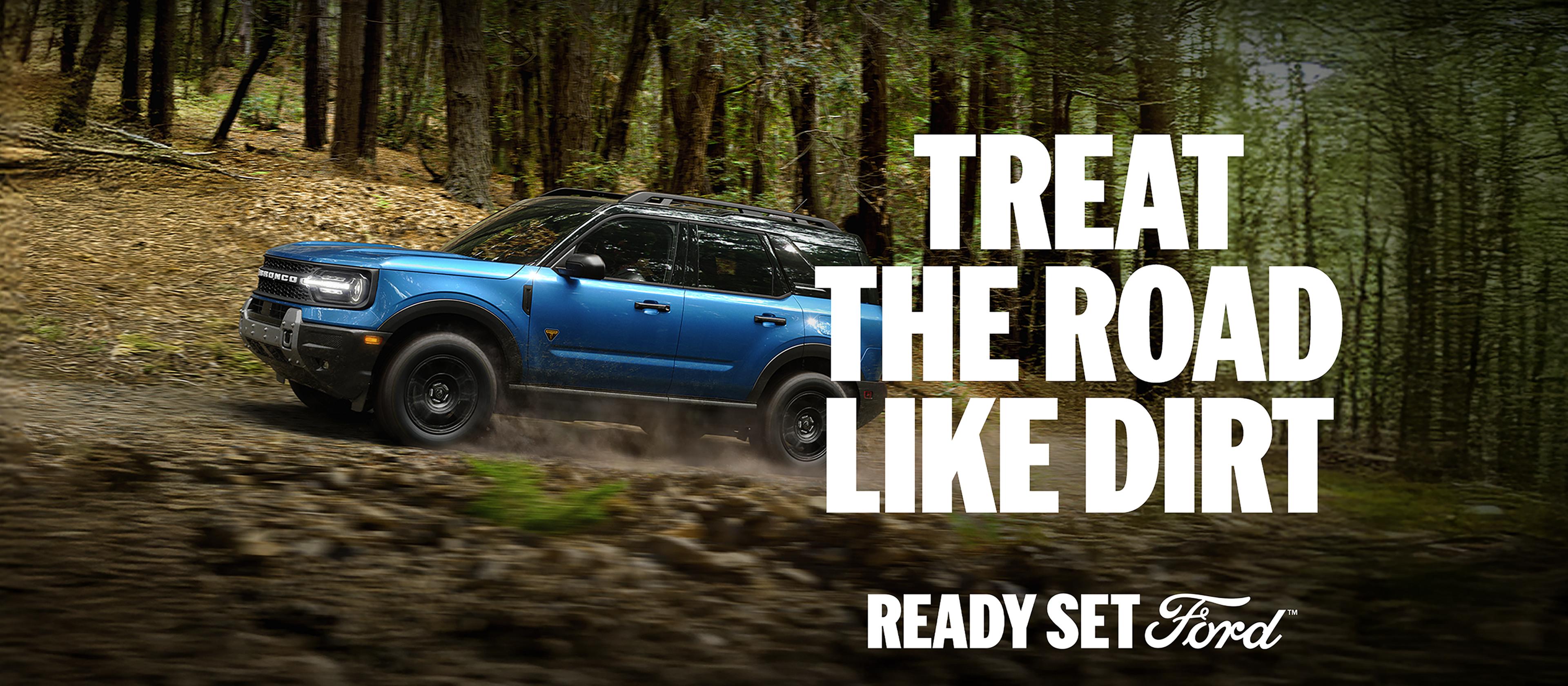 The 2025 Ford Bronco Sport® SUV kicks up dirt on a wooded trail