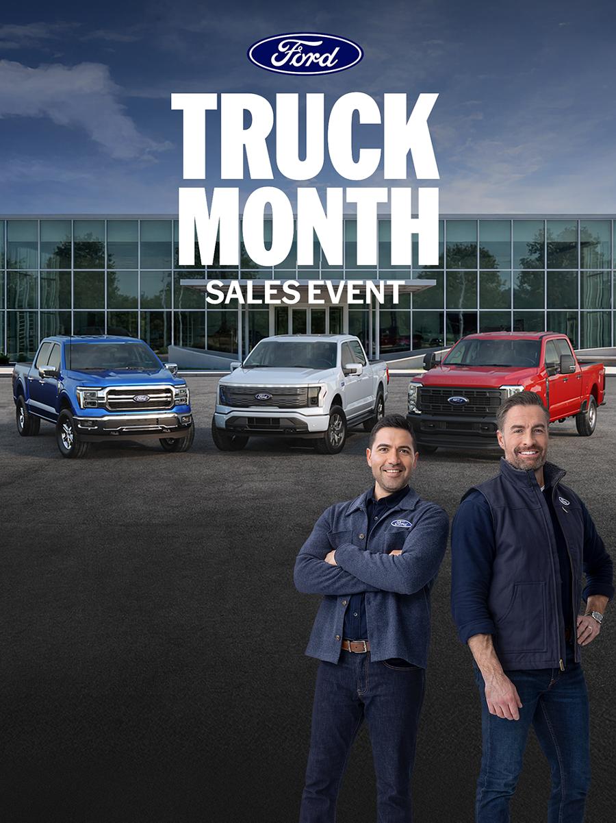 Ford Dealership with a family of Ford trucks and the Ford Crew promoting the Truck Month Sales Event