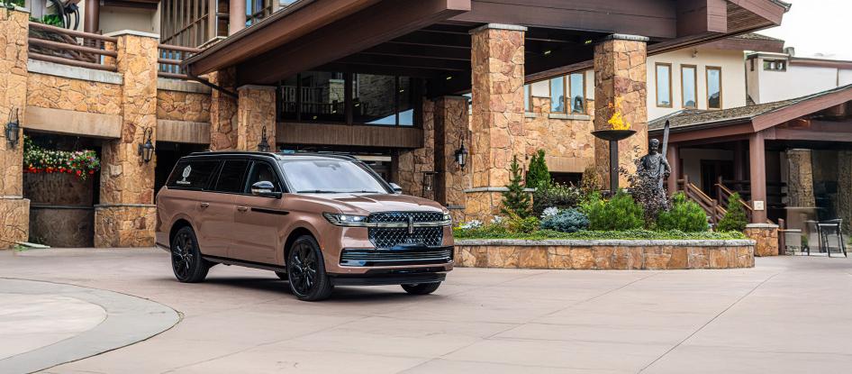 The Lincoln Navigator parked outside a hotel.
