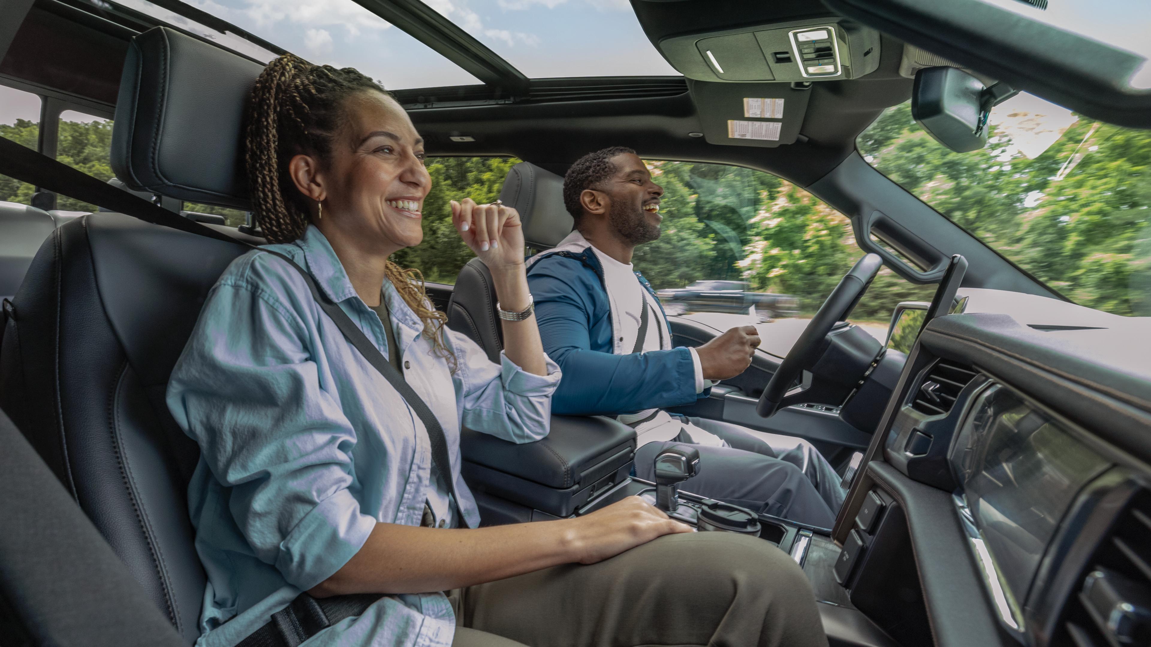 A couple using BlueCruise in a Ford electric vehicle