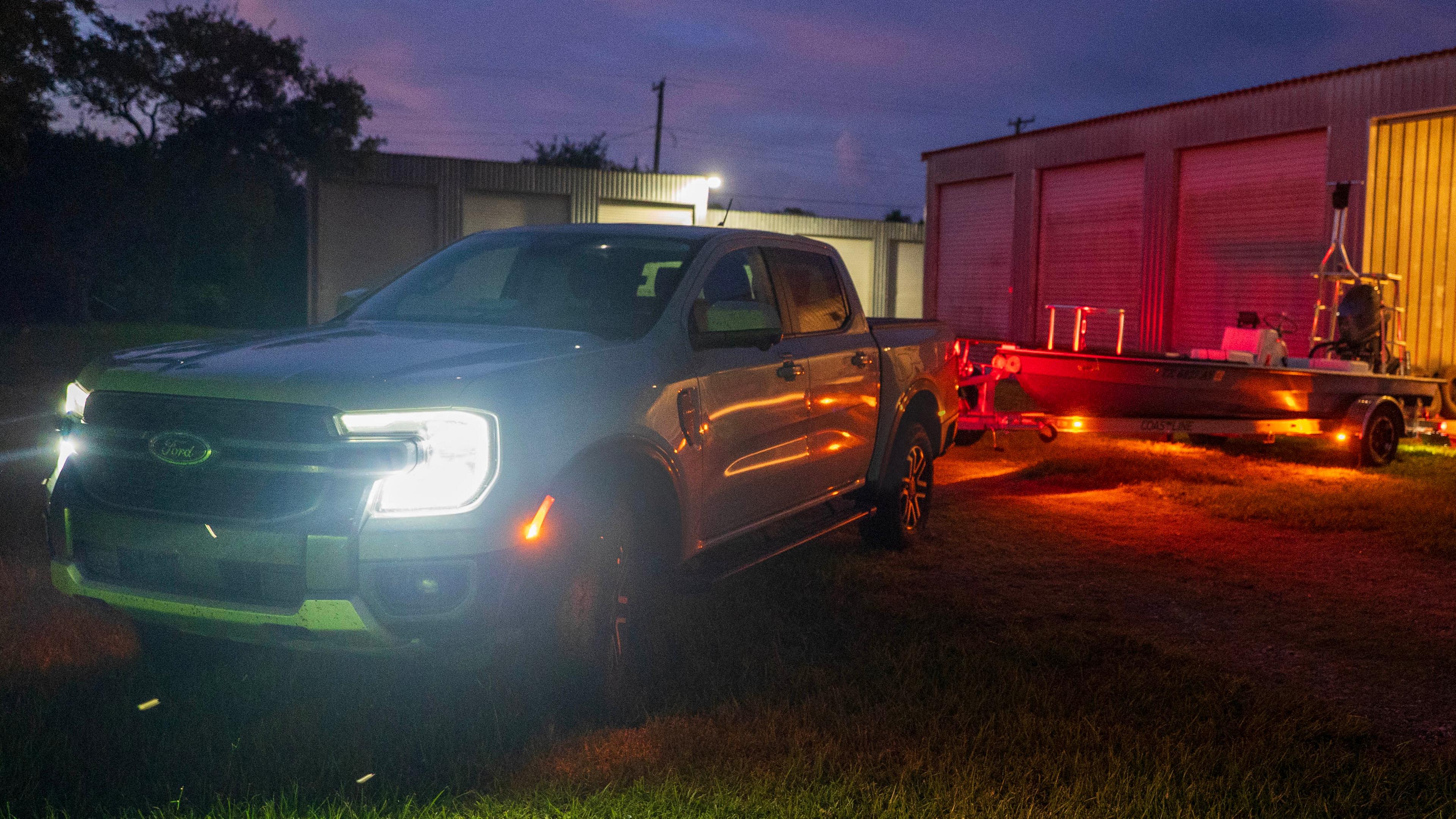 2026 Ford Ranger® Lariat® model with a trailer using the Trailer Light Check feature in the dark