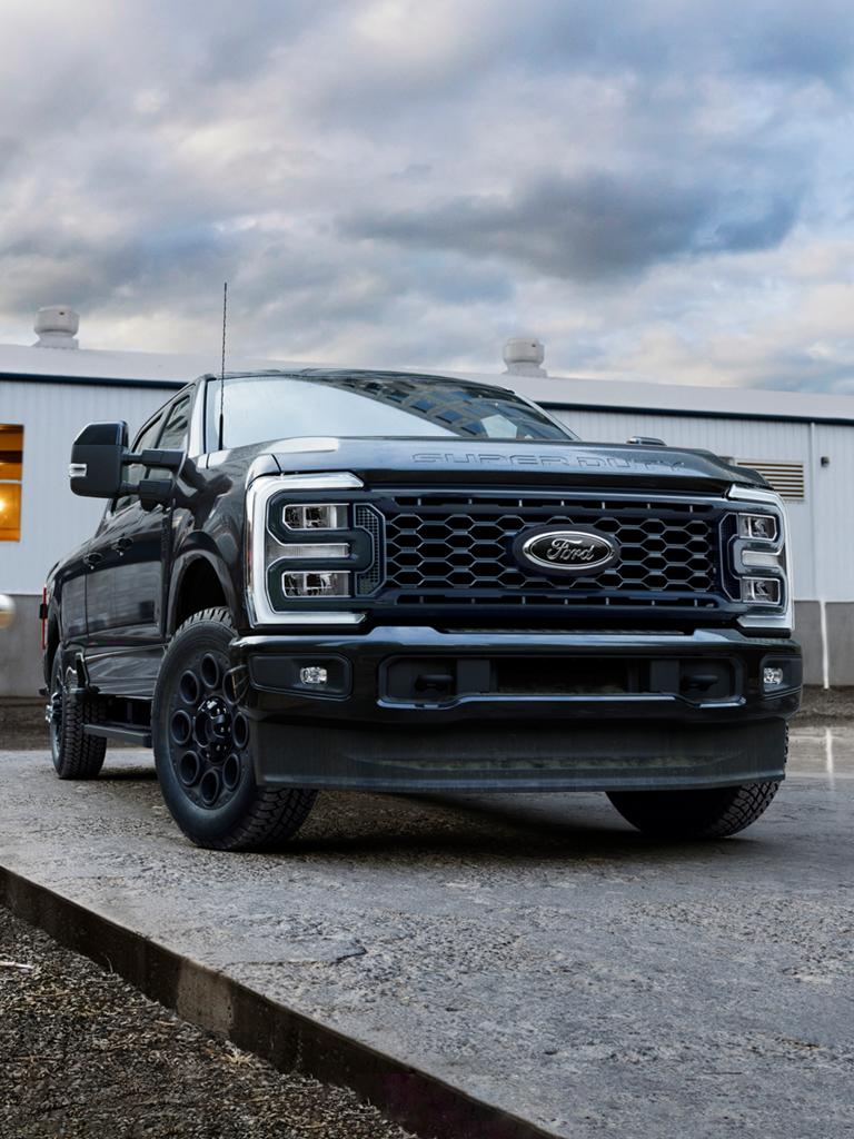 2026 Ford Super Duty® F-250® Lariat® with the Black Appearance Package parked on a cement slab