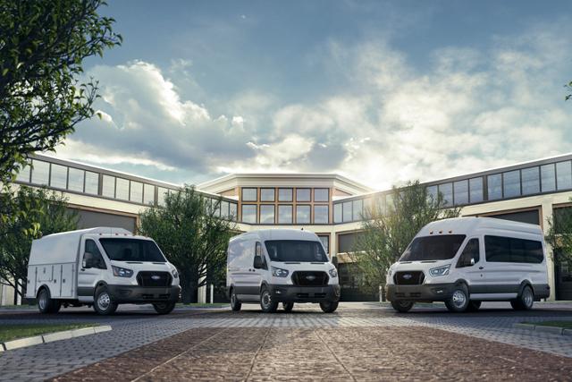Three 2025 Ford Transit® Vans parked outside an office building