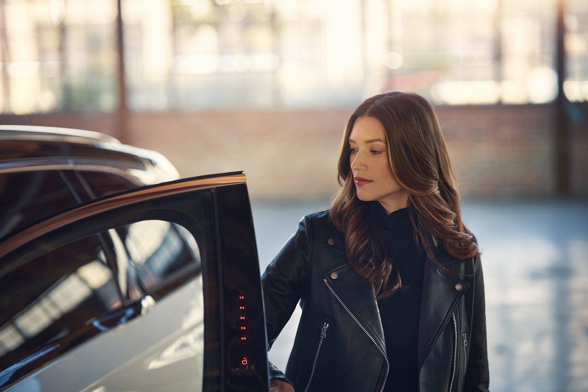 The keyless entry pad is illuminated on the door frame of a 2025 Lincoln Black Label Nautilus SUV