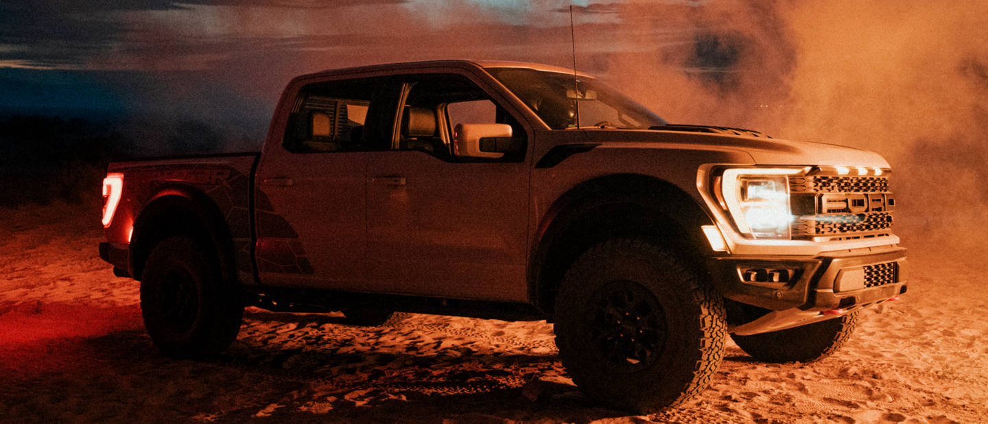 Image of the 2023 Ford F-150® Raptor® R parked in desert with dust blowing 